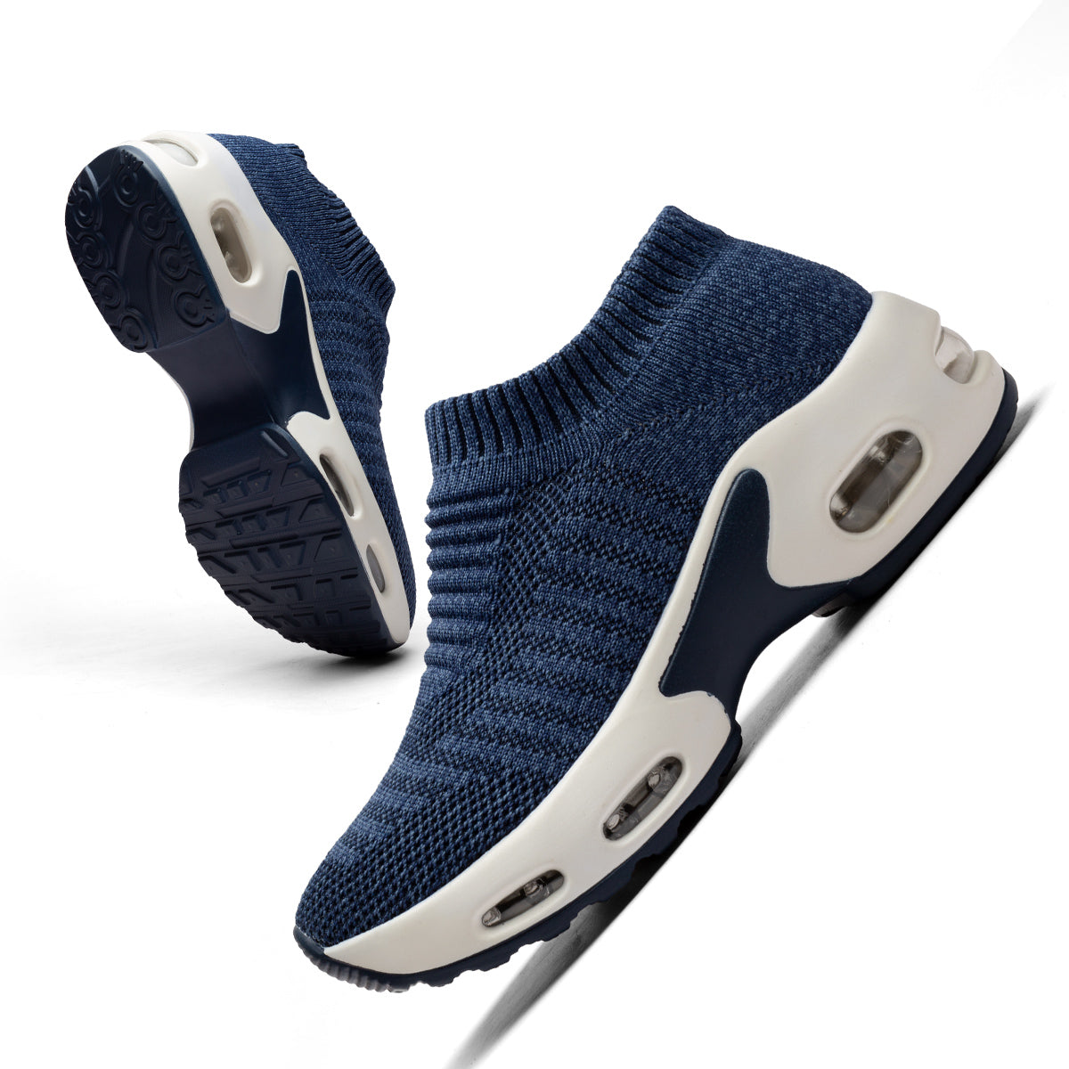 Navy blue knit sock sneakers with thick white platform soles and visible air cushions.